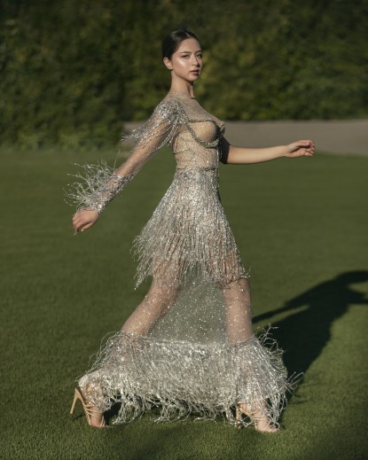 Long dress with fringed on the sleeves and the skirt